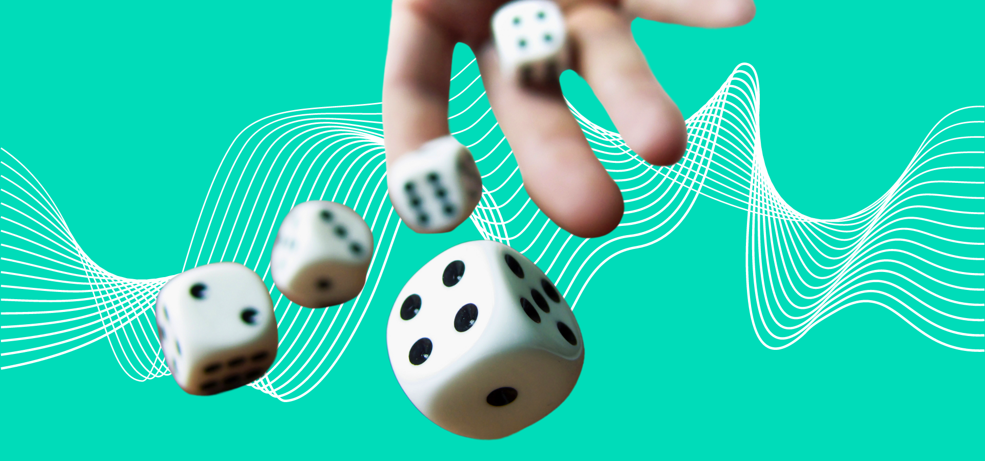 A hand rolling 5 dice