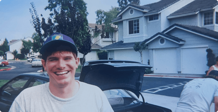 Mike Boeldt in front of a garage