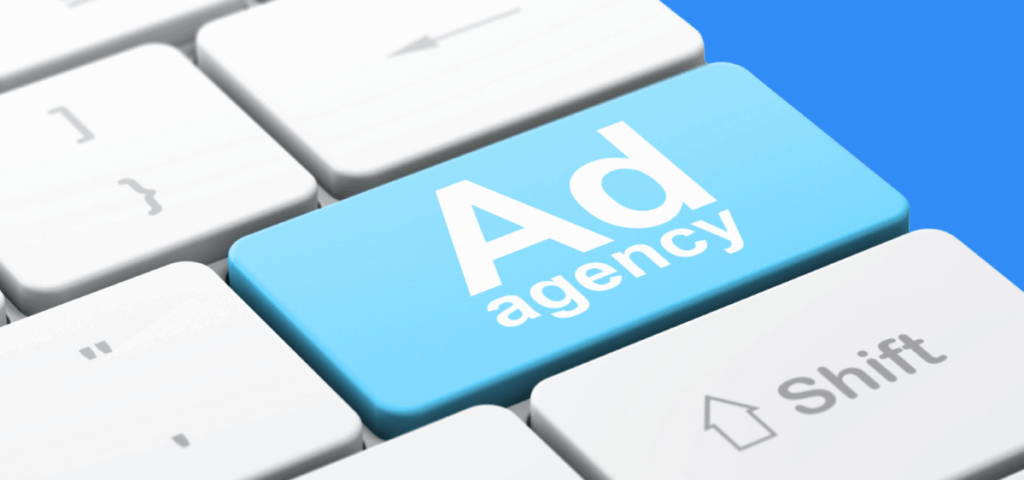 Keyboard with a blue button that reads, "Ad agency."