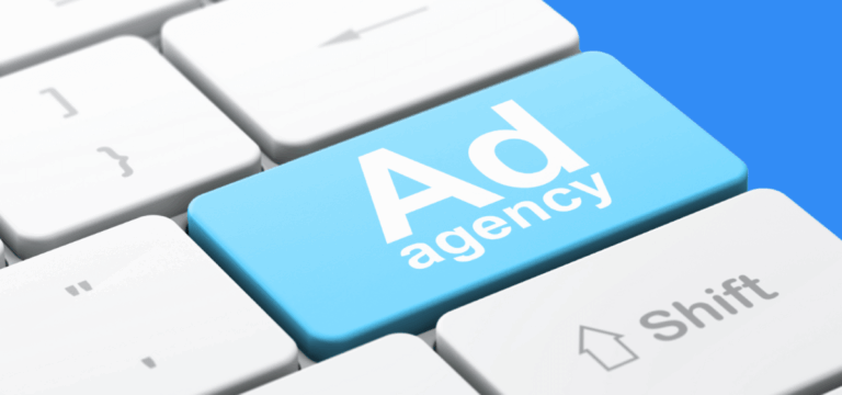 Keyboard with a blue button that reads, "Ad agency."