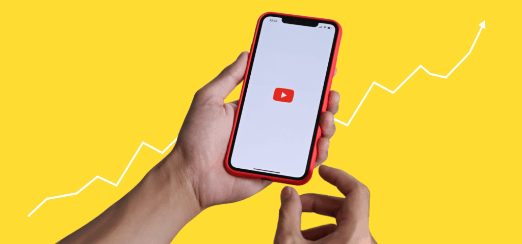 Yellow background with hands holding a phone with the YouTube logo on it