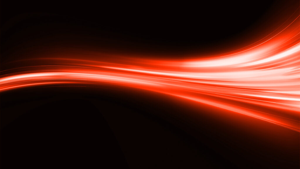 Stream of red and white light across a black background
