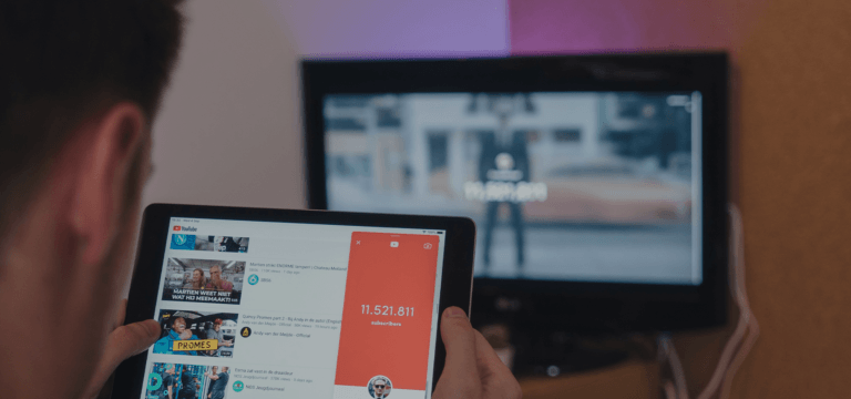 someone on a tablet and tv