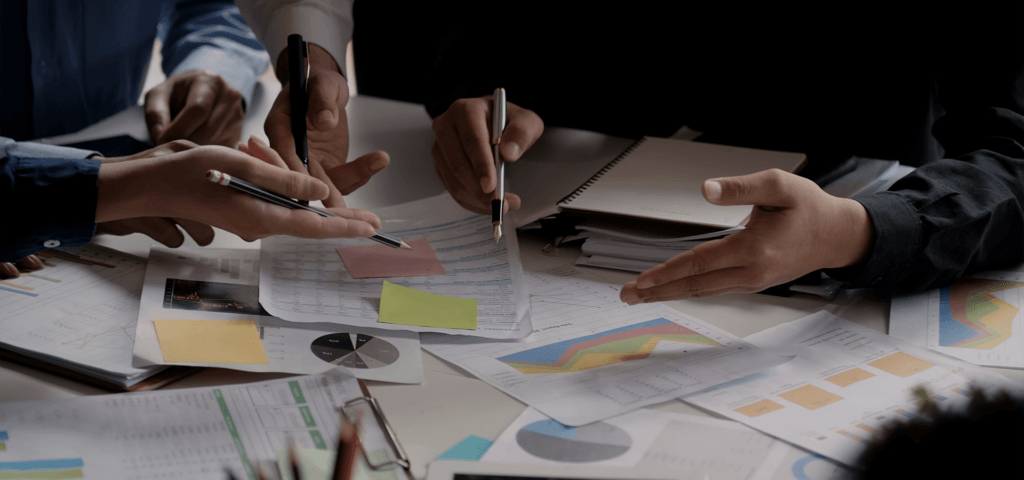 paper spread out on table with data and measurements