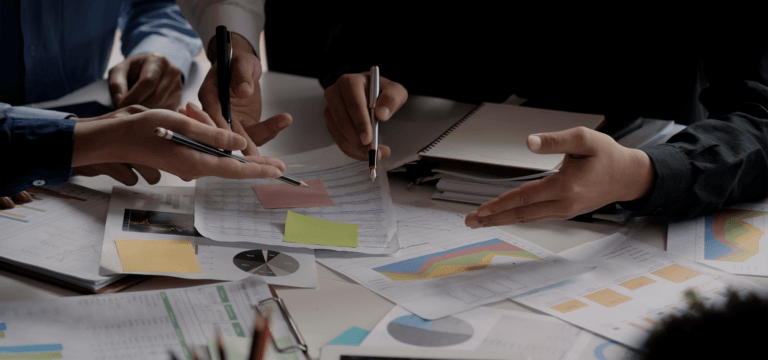 paper spread out on table with data and measurements