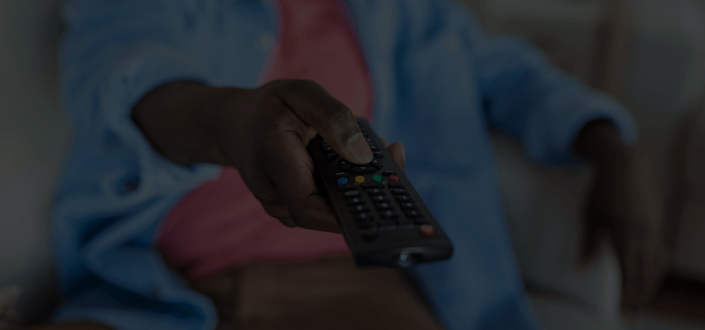 Someone pointing the remote at the TV