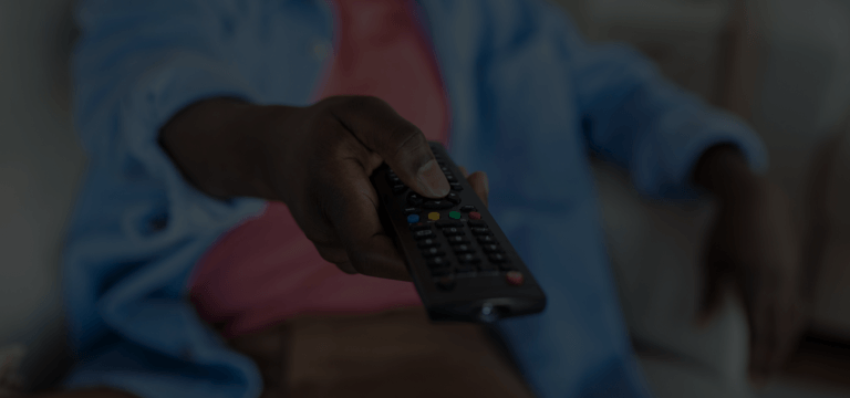 Someone pointing the remote at the TV